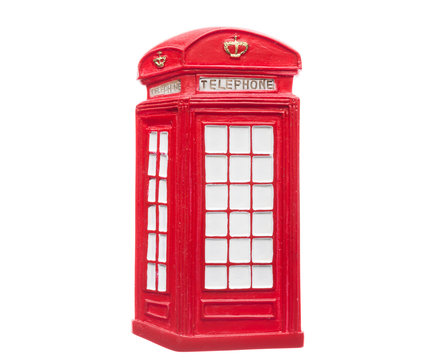 Souvenir in England UK. Red London obsolete telephone box. Classic british landmark icon as a magnet isolated on white