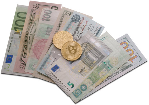 Golden bitcoin on different bills close up shot