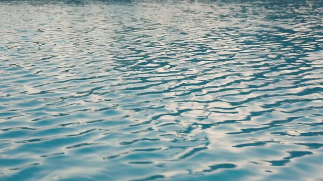 Ripples on the water in the pool. Overflow swimming pool