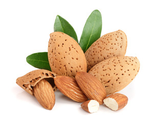 Group of almond nuts with leaves isolated on white background