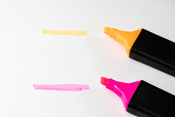 Highlighter on a white background. Office Mazaki to the sketch lie on a white countertop.