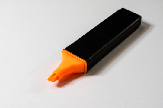 Highlighter on a white background. Office Mazaki to the sketch lie on a white countertop.