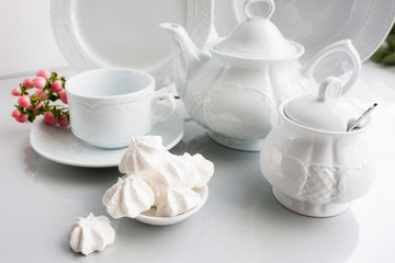 Porcelain tea set on white background. Luxury exquisite and expensive crockery concept