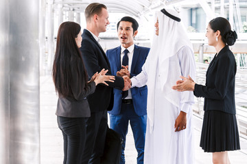 Successful businessmen handshake partner with arab businessman