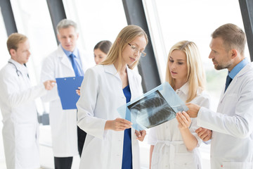 Group of doctors discuss x-ray