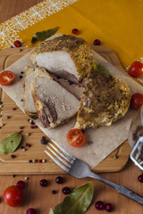 Baked meat on wooden frne with fresh vegetables and pepper/food