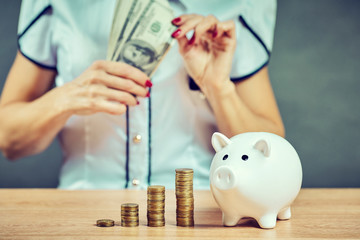 Piggy bank savings woman smiling happy