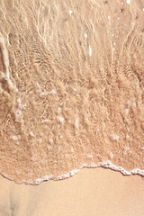 Fototapeta na wymiar wave on sandy beach