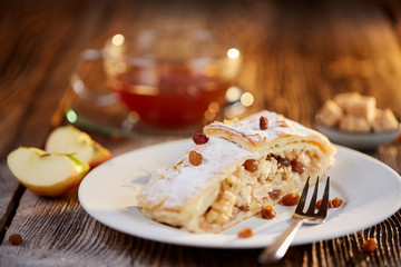 Apfelstrudel with raisins on a plate