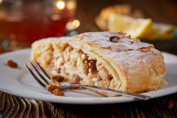 Apfelstrudel with raisins on a plate - 183187281