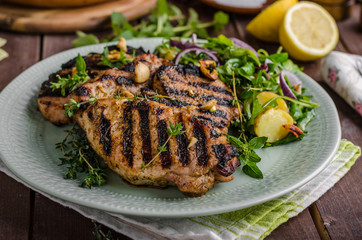 Grilled pork chops with lettuce salad