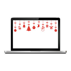 Laptop with Christmas hanging ornaments