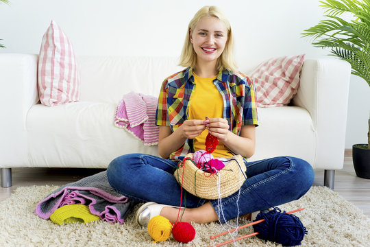 Girl knitting at home