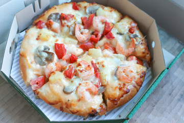 shrimp pizza in the box