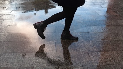 Female walking after the rain.
