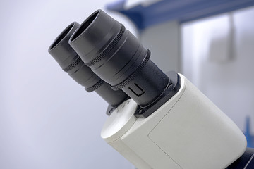 The lenses of the microscope, the upper part of them.