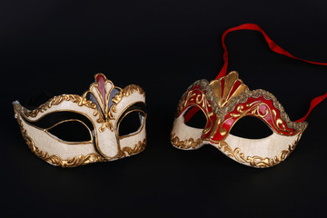 Venetian carnival masks on black background
