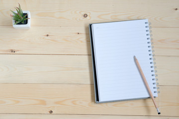 Top view of notebook with pencil