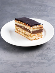 Cake Opera on a gray background, vertical, selective focus