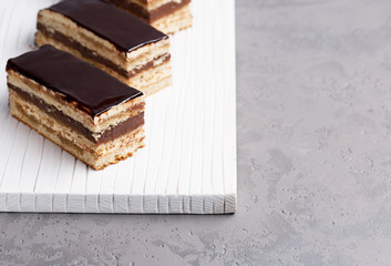 Cake Opera on a gray background, vertical, selective focus