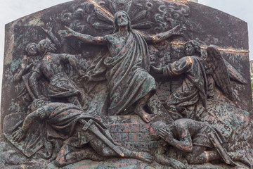 Beautiful ruined sculpture where jesus is seen overcoming the evil power