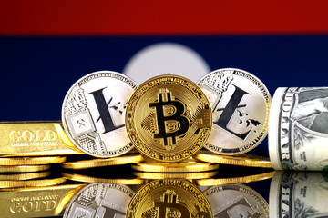 Physical version of Bitcoin, Litecoin, gold, US Dollar and Laos Flag. Conceptual image for...