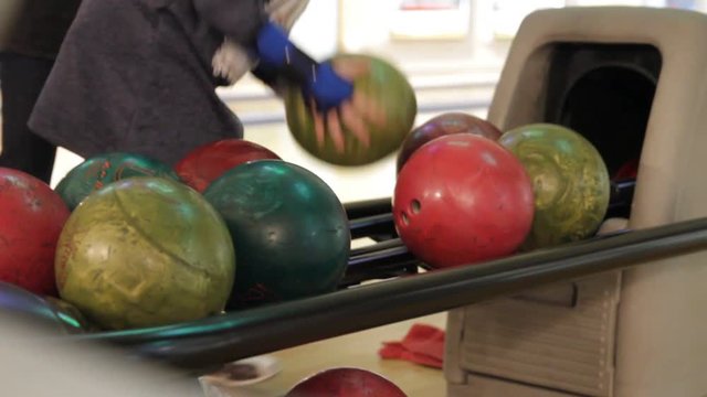 People playing a game of bowling at the small town bowling alley in Kiev, Ukraine, 02.12.2017