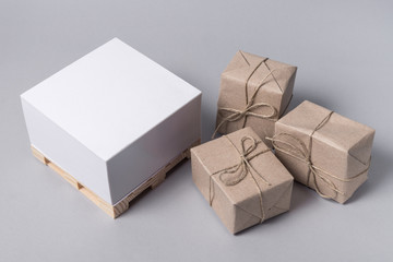 Small pallet and package boxes on grey background, Cargo freight ship,  Logistic Import Export concept