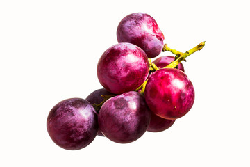 Red grapes cooked on white back ground.