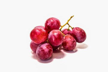 Red grapes cooked on white back ground.