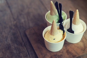 Ice cream flavors in cup and topping, sweet and dessert food concept