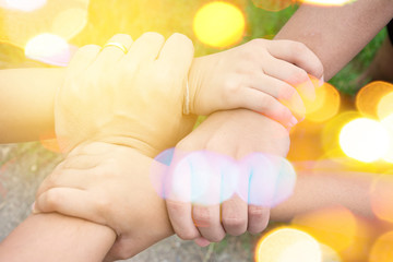 harmonious hand of team work under warm light