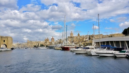 Modern Boats in front of the historical part of Malta