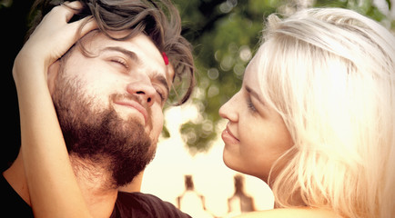 Young couple hug each other.