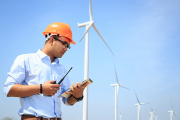 Engineers are investigating the wind turbine.