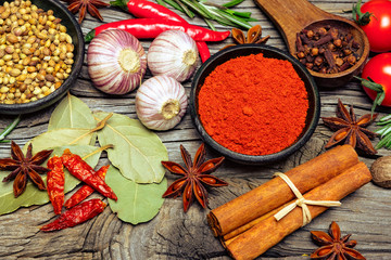 Spices and herbs on wooden background