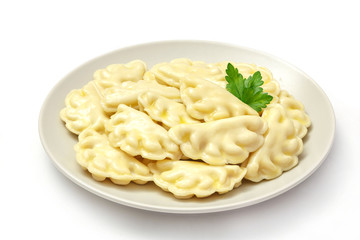 Meat dumplings - russian pelmeni, ravioli with meat on a plate on a white background, isolated