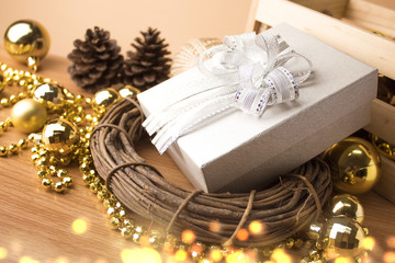 gift box with gold christmas decor and bokeh