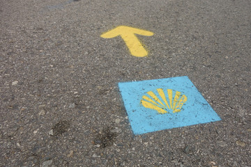 Camino de santiago sign painted on the asphalt road