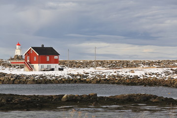 Vernacular architecture-wooden cottage of board and batten siding-small lighthouse. Laukvik-Austvagoya-Lofoten-Norway.0636