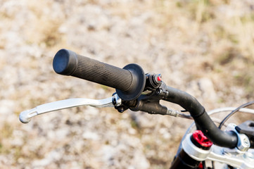 Close-up of the rudder handle handle of a trial motorcycle with brake