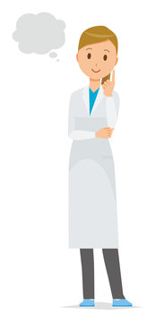 A female doctor wearing a white coat thinks