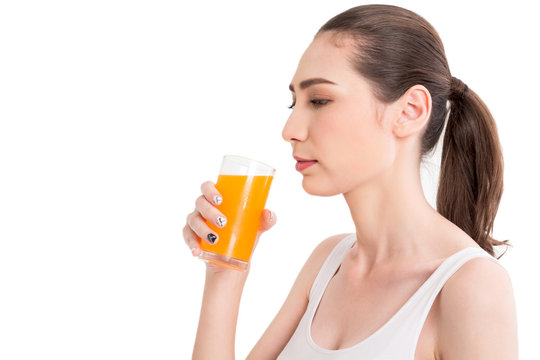 Woman holding orange juice isolated on white background