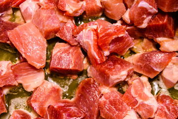 Background of the pork meat preparing in a slow cooker