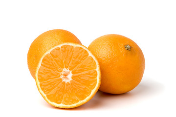 Ripe tangerines and half on white background