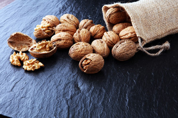 Walnut. Walnut kernels and whole walnuts in burlap sack.