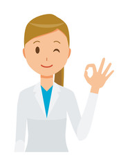 A female doctor wearing a white coat is playing an okay sign