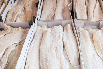 Dried salted cod fish bacalhau in traditional market in Palermo in Sicily, Italy.