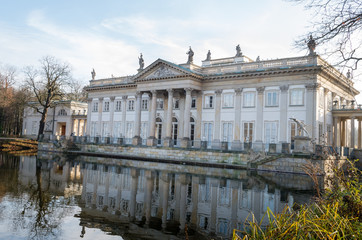 Historic palace by the lake during sunny fall day, Lazienki Krolewskie Warszawa Poland