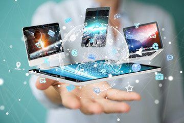 Tech devices connected to each other by businesswoman 3D rendering